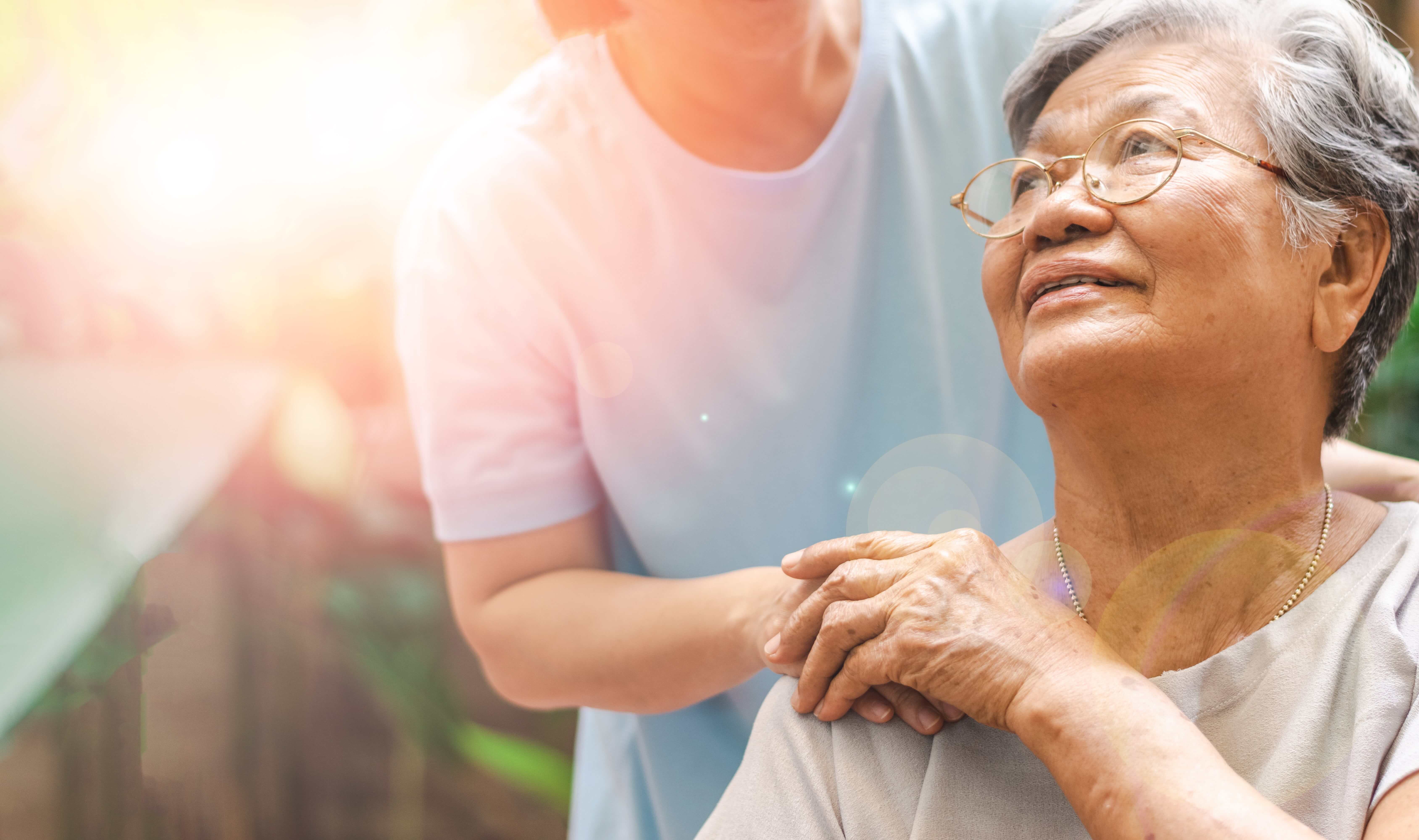 smiling woman holding hands with companion